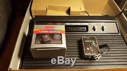 Vintage Atari 2600 in the box with sealed pac-man 2 joysticks vader oop nib