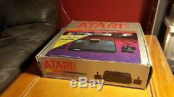 Vintage Atari 2600 in the box with sealed pac-man 2 joysticks vader oop nib